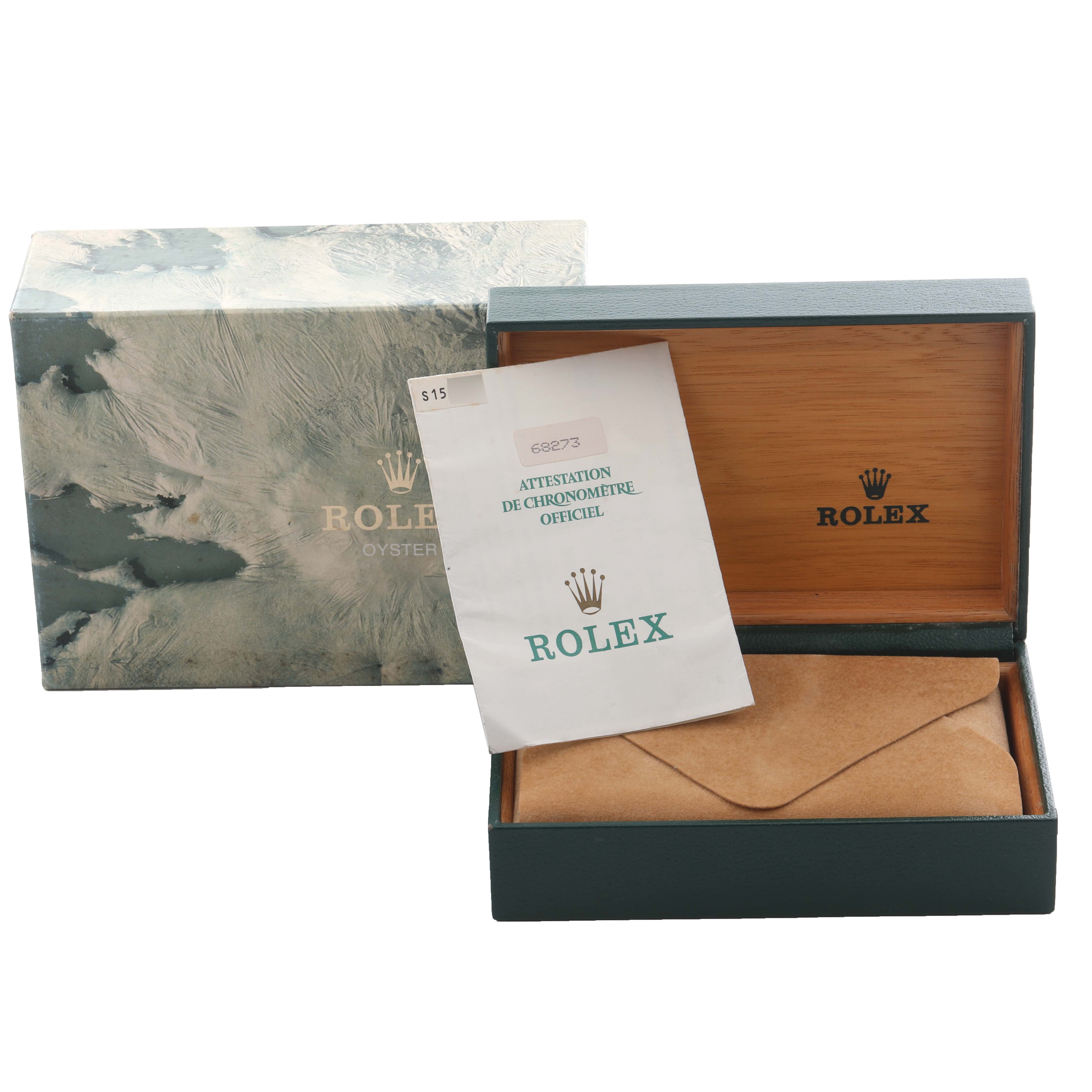 The image shows a Rolex Mid-Size 68273 Women's Steel and Gold (two tone) Champagne Dial 68273 Women's Steel and Gold (two tone) Champagne Dial model box with paperwork and packaging materials from a top angle.