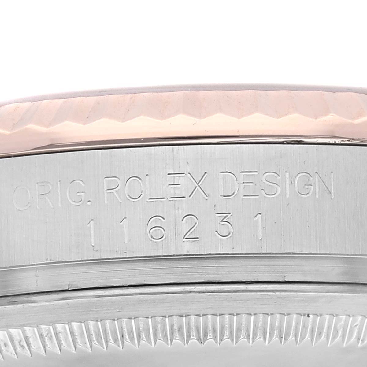 This image shows a close-up of the side engraving on a Rolex Datejust 116231 Men's Steel and Gold (two tone) Black Dial 116231 Men's Steel and Gold (two tone) Black Dial model with the model number 116231.