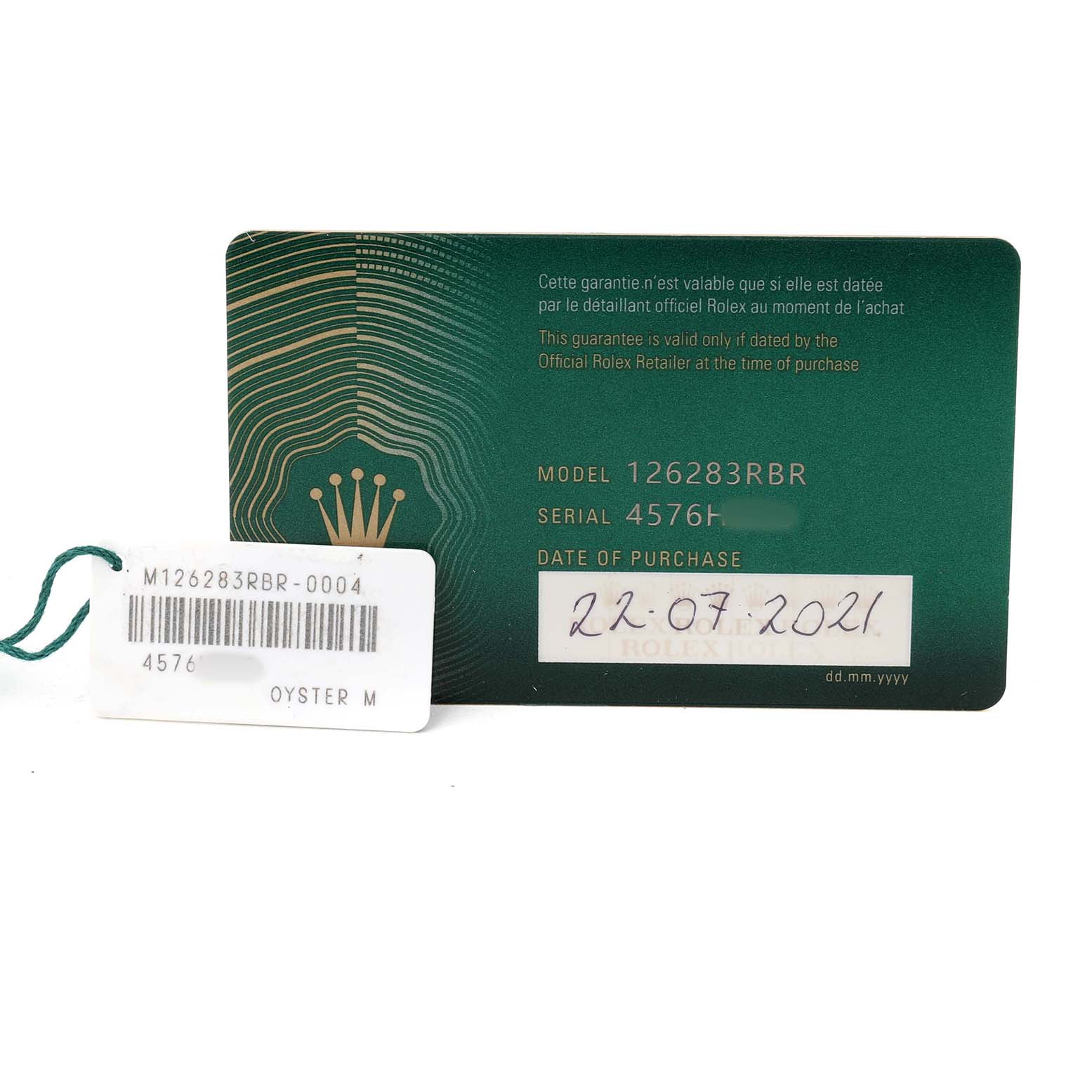 The image shows a Rolex Datejust 126283RBR Men's Steel and Gold (two tone) Champagne Dial warranty card and tag with model and serial numbers, viewed from the front.