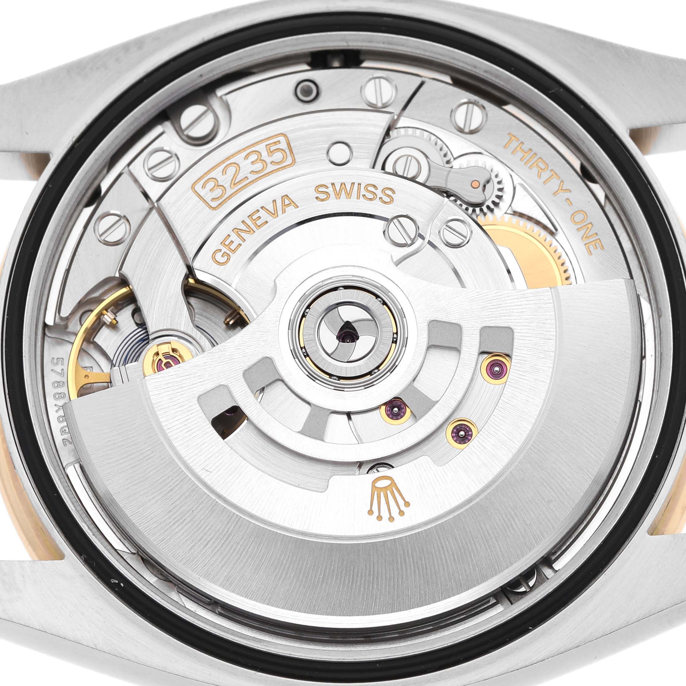 The image shows the movement of a Rolex Datejust 126283RBR Men's Steel and Gold (two tone) Champagne Dial watch from the back, highlighting the rotor and gears.