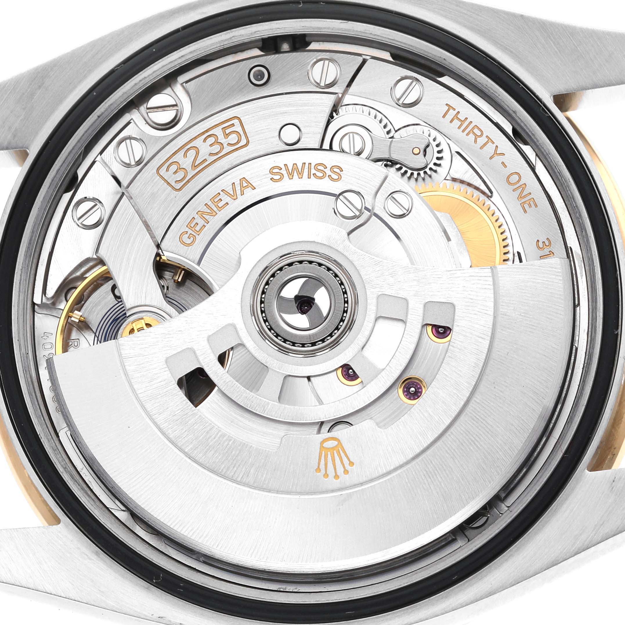 The image shows the movement mechanism of a Rolex Datejust 126283 Men's Steel and Gold (two tone) Grey Dial watch from a back angle, highlighting gears and the rotor.
