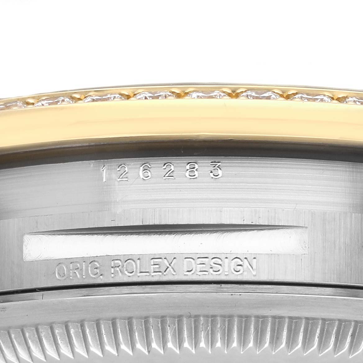 The image shows a side view of the Rolex Datejust 126283 Men's Steel and Gold (two tone) Grey Dial model's case, featuring the bezel and "ORIG. ROLEX DESIGN" engraving.
