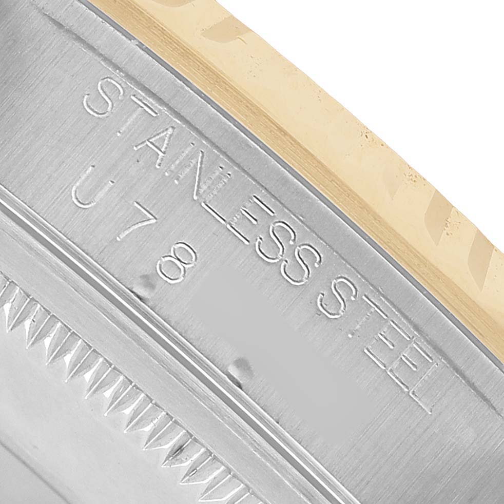 The image shows a close-up of the side of a Rolex Datejust 16233 Men's Stainless Steel White Dial, highlighting the "STAINLESS STEEL" engraving on the case edge.