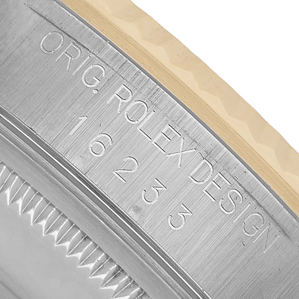 The image shows a close-up of the side engraving on the case of a Rolex Datejust 16233 Men's Stainless Steel White Dial watch, featuring the model number and "ORIG. ROLEX DESIGN."