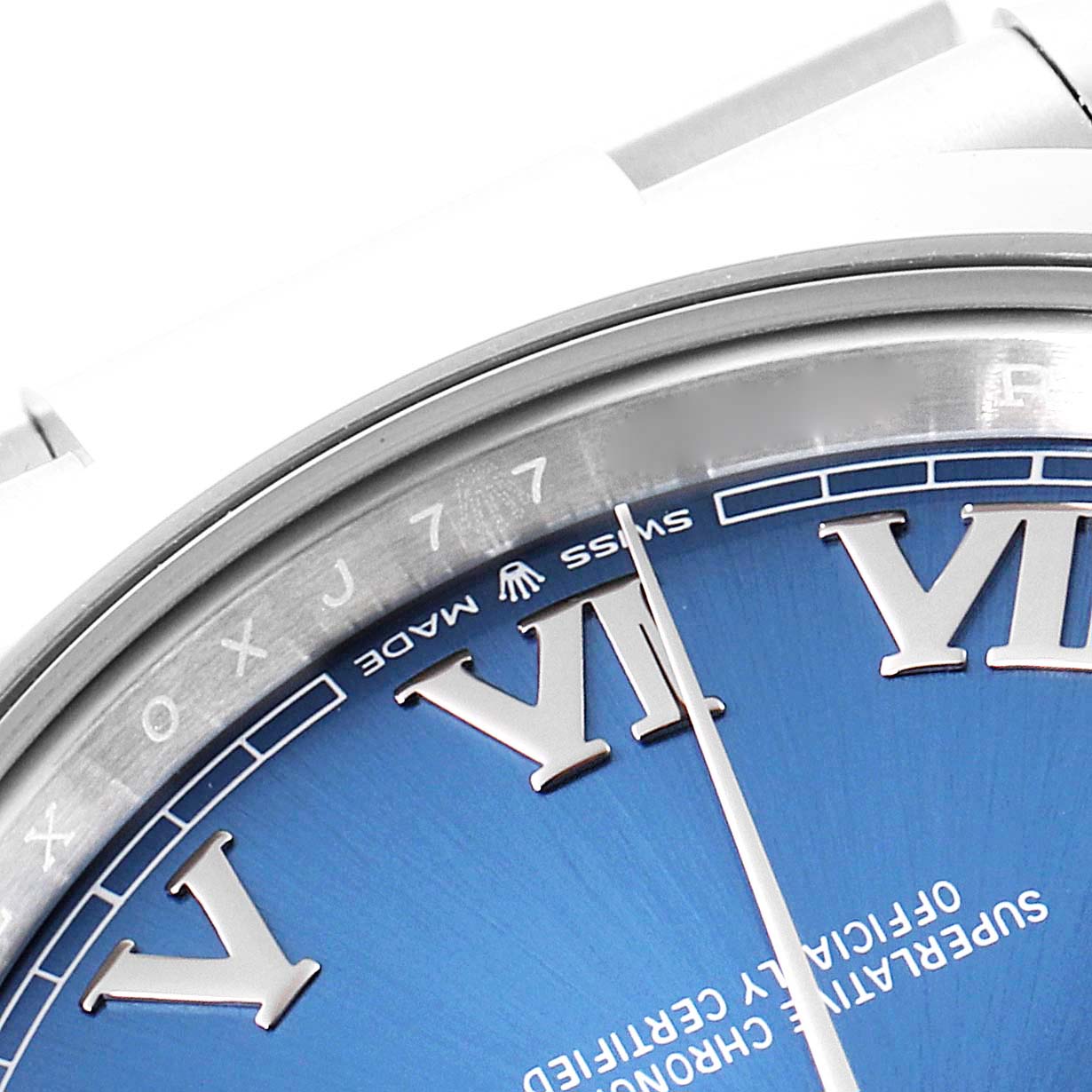 This close-up image of the Rolex Datejust 41 126300 Men's Stainless Steel Blue Dial 126300 Men's Stainless Steel Blue Dial watch shows part of the dial and the edge of the case.