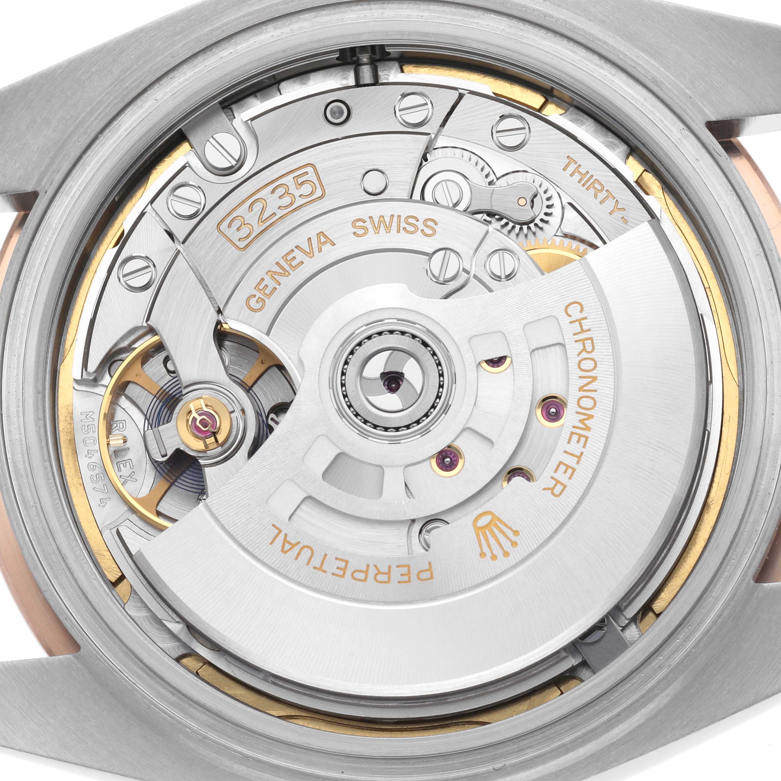 This image shows the movement of the Rolex Datejust 41 126331 Men
s Steel and Gold (two tone) Grey Dial 126331 Men
s Steel and Gold (two tone) Grey Dial from a straight-on angle, revealing the intricate mechanical components.