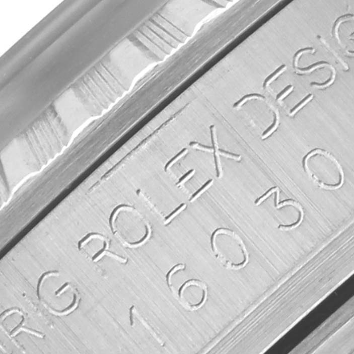 The image shows a close-up of the side engraving on a Rolex Datejust 16030 Men's Stainless Steel Silver Dial 16030 Men's Stainless Steel Silver Dial watch, highlighting the model number.