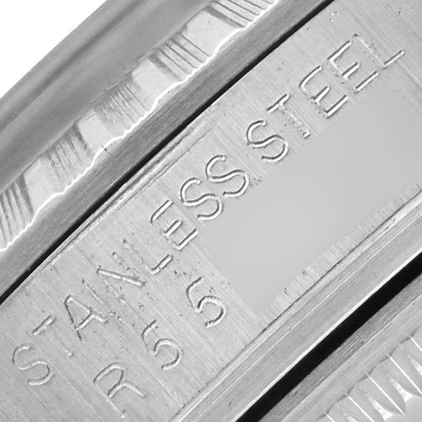 The image shows a close-up of the stainless steel engraving on the side of a Rolex Datejust 16030 Men's Stainless Steel Silver Dial 16030 Men's Stainless Steel Silver Dial watch.