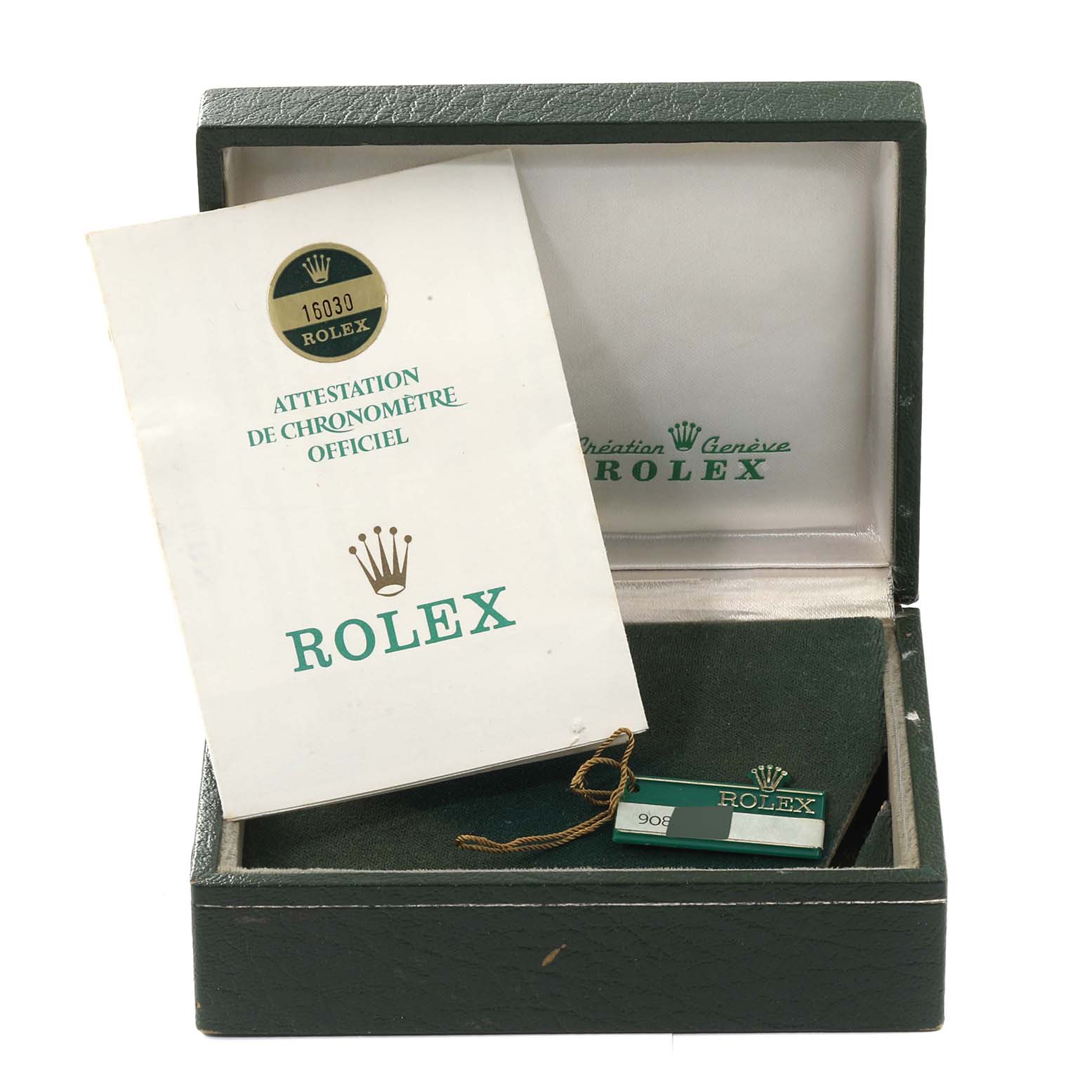 The image shows the open box, booklet, and tag for a Vintage Collection model by Rolex.