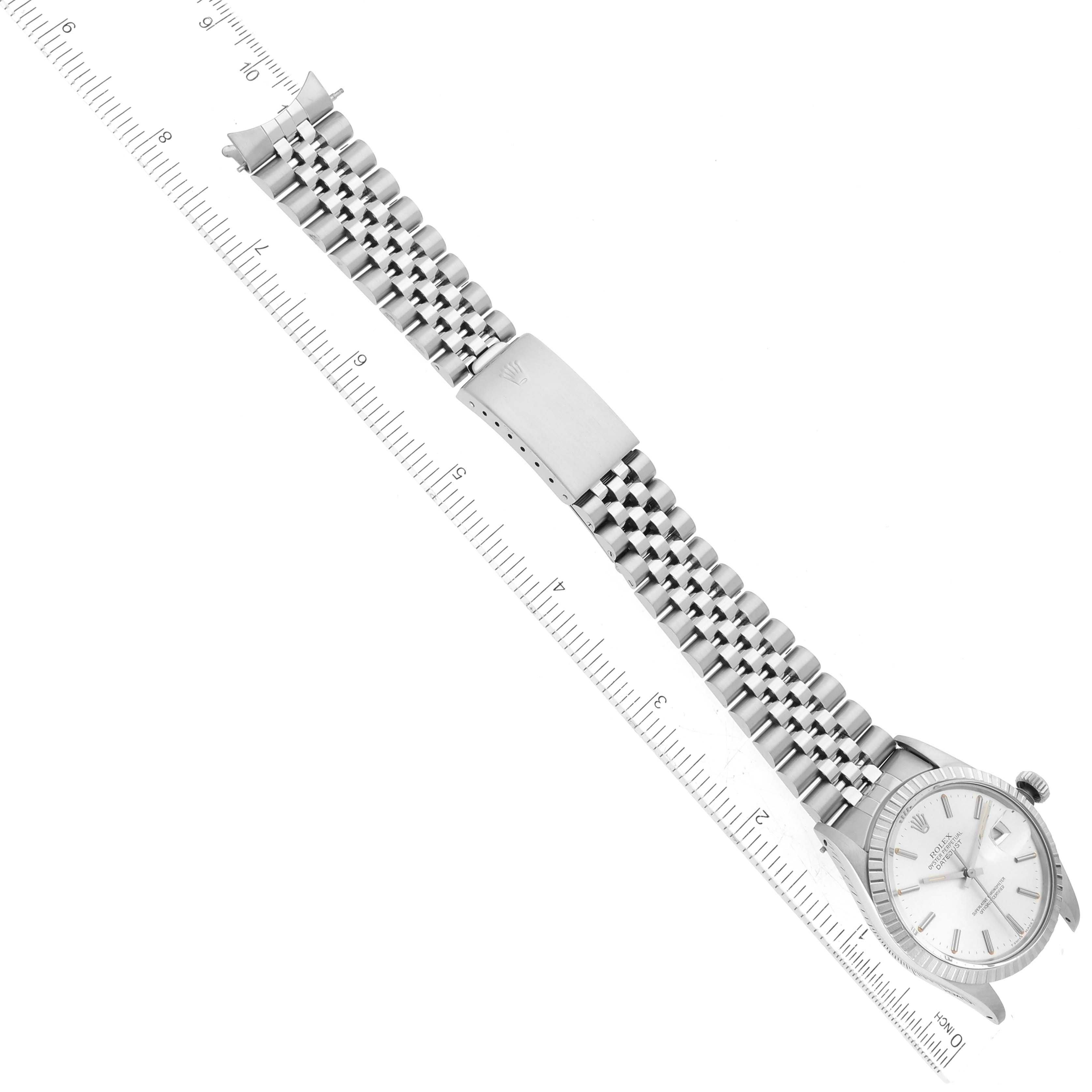The Vintage Collection Rolex watch is shown flat with the face, band, and part of the clasp visible, aligned next to a ruler.