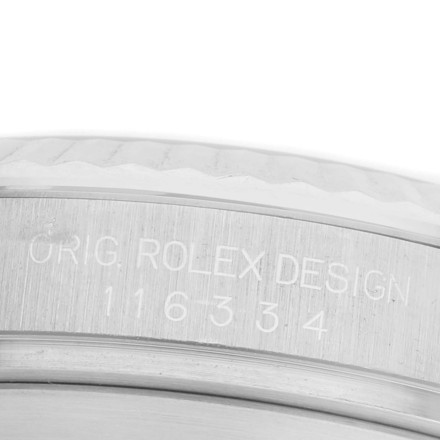 The image shows a close-up of the side engraving on the bezel of a Rolex Datejust 41 116334 Men
s Stainless Steel Grey Dial 116334 Men
s Stainless Steel Grey Dial model.