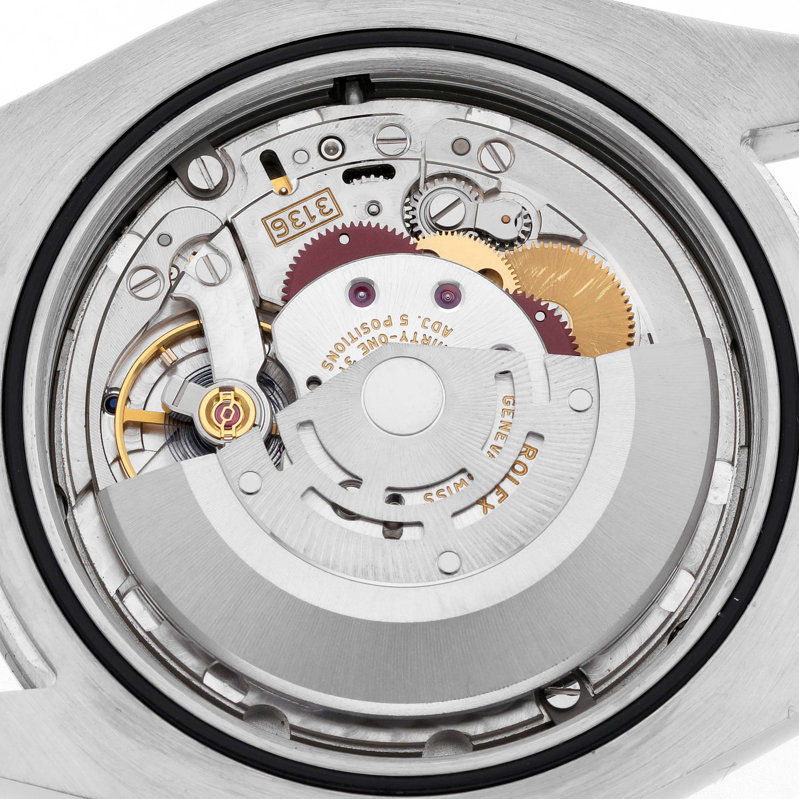 The image shows the inner mechanism of a Rolex Datejust 41 116334 Men
s Stainless Steel Grey Dial 116334 Men
s Stainless Steel Grey Dial, revealing gears and the rotor from a top-down angle.