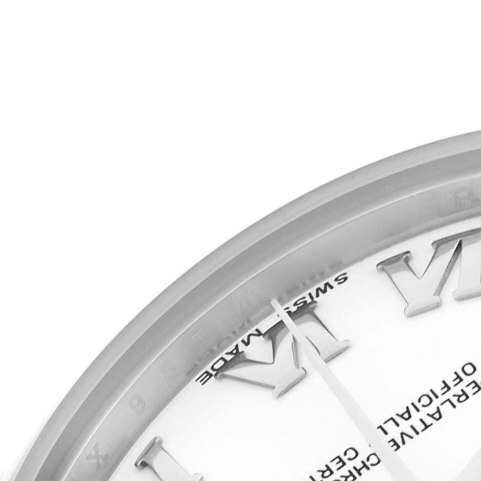 The image shows a close-up of the dial and Roman numerals of a mid-size Rolex watch at an oblique angle.