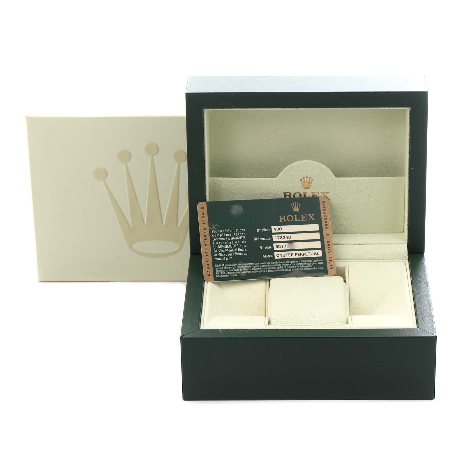The image shows a Rolex watch box at a front angle with the warranty card, featuring the model name Oyster Perpetual.