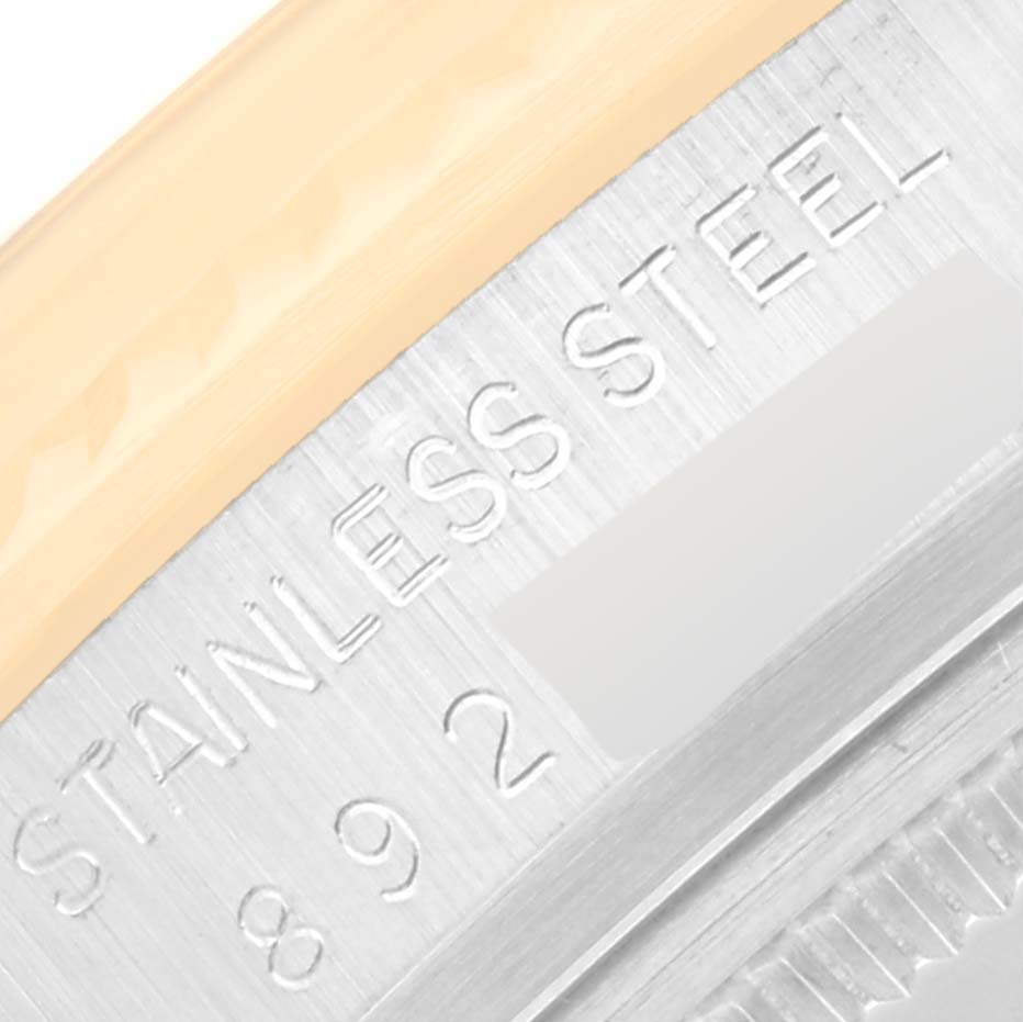 This close-up image shows the side of a Vintage Collection Rolex watch, specifically highlighting the "STAINLESS STEEL" engraving.