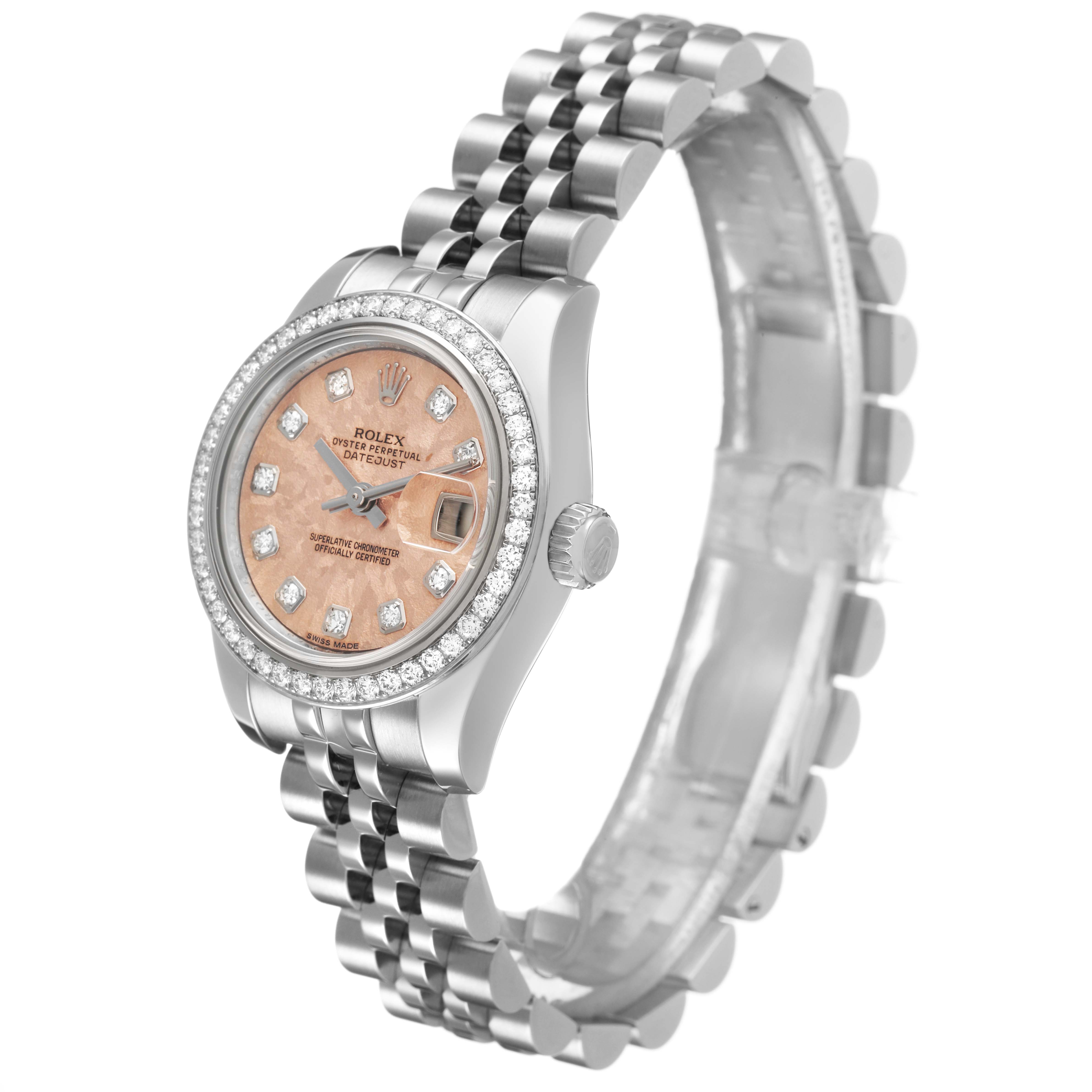 The Rolex Datejust 179384 Women's Stainless Steel Pink Dial watch is shown from a side angle, highlighting the bezel, dial, crown, and partially extended bracelet.