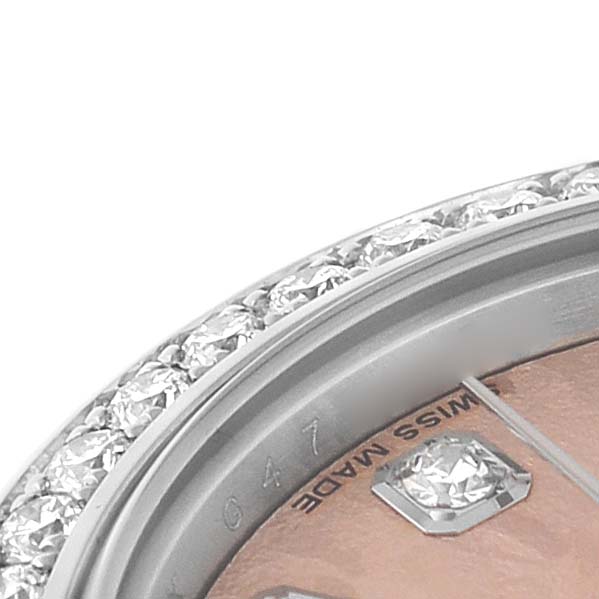 The image shows the diamond-set bezel and part of the dial with markers of a Rolex Datejust 179384 Women's Stainless Steel Pink Dial watch at a close-up angle.