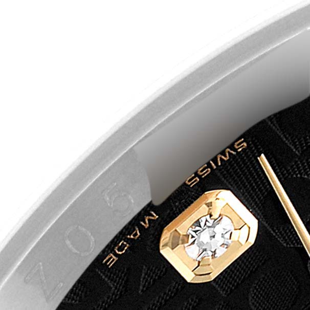 The image shows a close-up detail of a Rolex Datejust 116233 Men's Steel and Gold (two tone) Black Dial 116233 Men's Steel and Gold (two tone) Black Dial watch, focusing on a diamond-set hour marker and the edge of the dial marked "SWISS MADE."