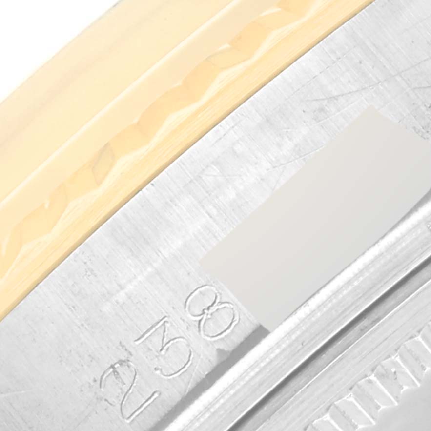 This image shows a close-up of the side casing and bezel of the Vintage Collection model by Rolex.