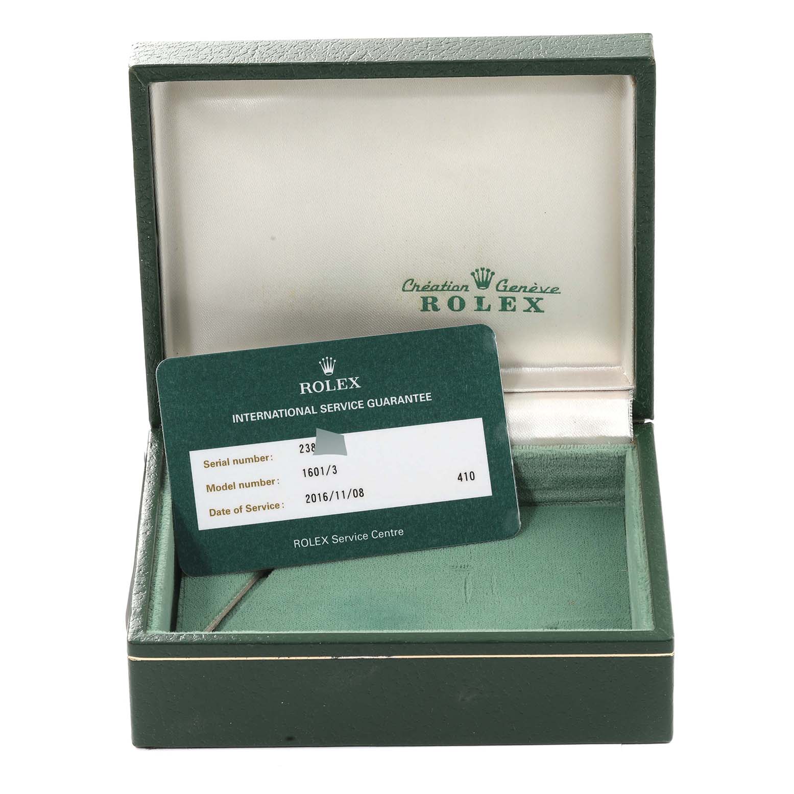The image shows the open box and international service guarantee card for the Rolex Vintage Collection 1601/3 Men's Steel and Gold (two tone) Black Dial 1601/3 Men's Steel and Gold (two tone) Black Dial model 1601/3.