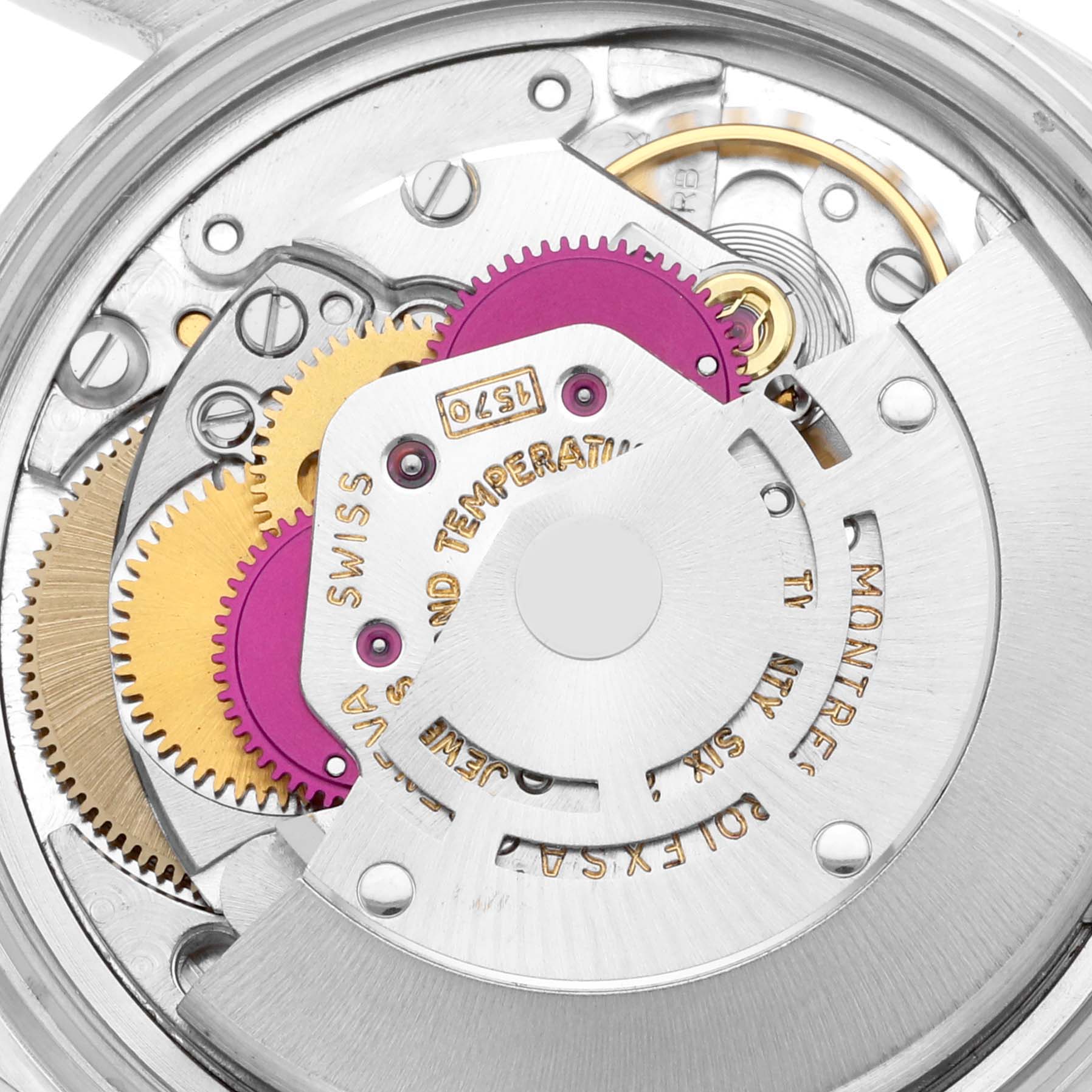 This is a close-up of the Vintage Collection Rolex watch movement showing its intricate gears and mechanical components.