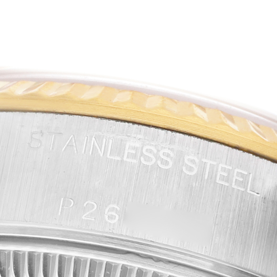 The image shows a close-up of the side engraving and bezel edge of a Rolex Datejust 79173 Women's Stainless Steel Champagne Dial watch.