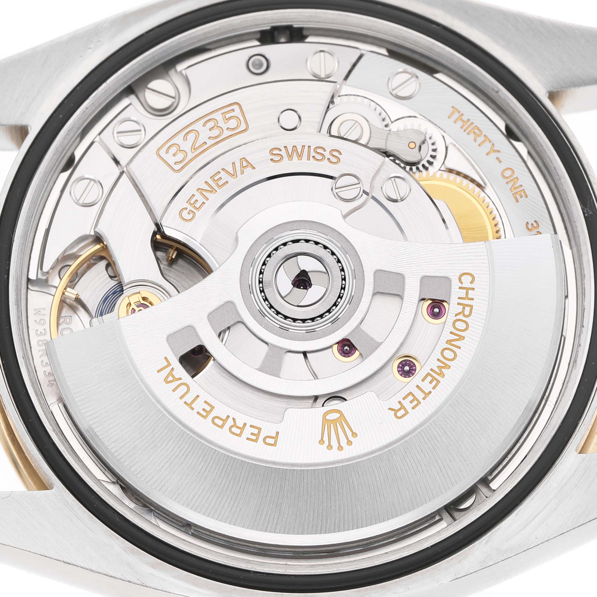The image shows the movement of a Rolex Datejust 126233 Men's Steel and Gold (two tone) Champagne Dial, highlighting the 3235 caliber from a top-down angle.