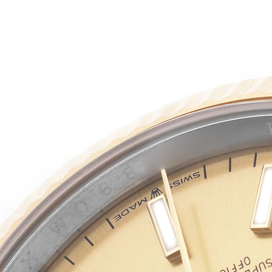 The image shows a close-up of the dial, bezel, and hour markers of a Rolex Datejust 126233 Men's Steel and Gold (two tone) Champagne Dial watch.