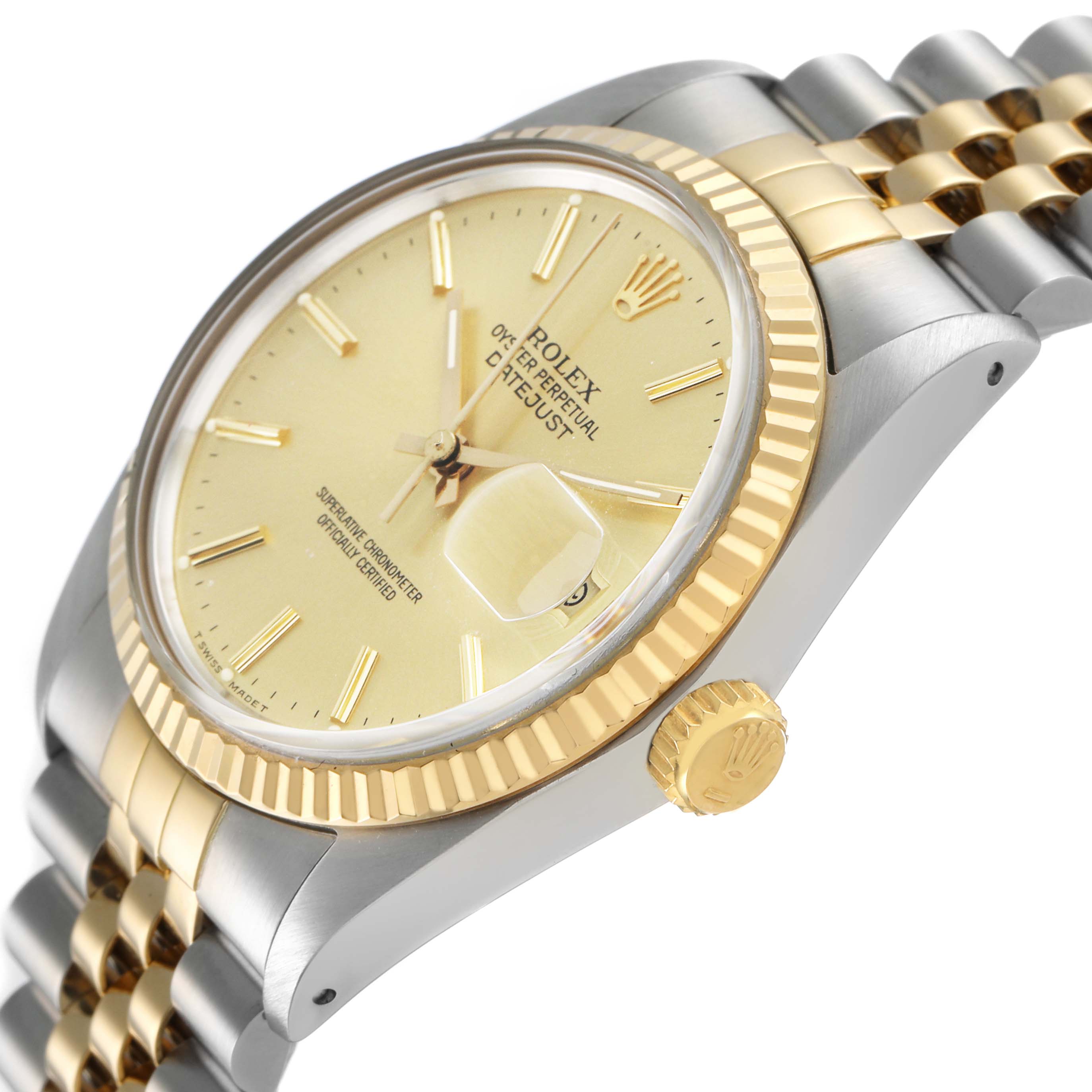 The Rolex Datejust 16013 Men's Steel and Gold (two tone) Champagne Dial watch is shown at a slight angle highlighting the face, fluted bezel, crown, and two-tone bracelet.