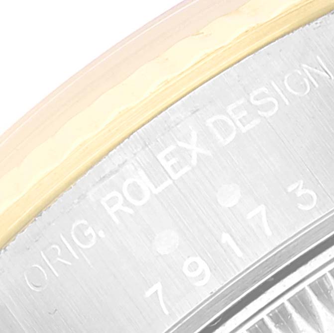 This image shows a close-up of the engraving on the case back edge of a Rolex Datejust 79173 Women's Steel and Gold (two tone) Beige Dial 79173 Women's Steel and Gold (two tone) Beige Dial watch.