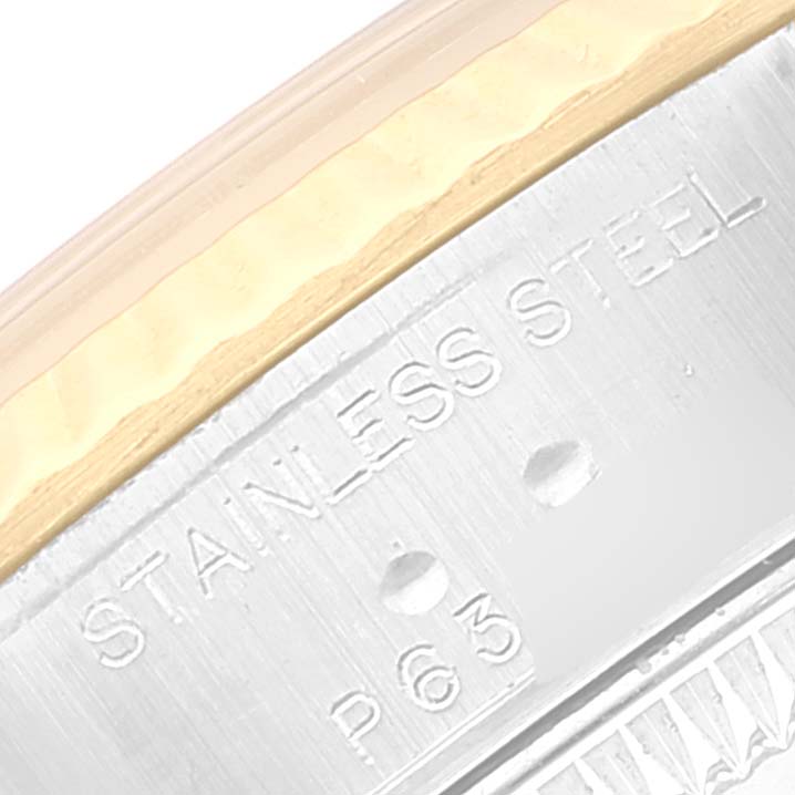 This image shows a close-up of the engraved "STAINLESS STEEL" marking on the Rolex Datejust 79173 Women's Steel and Gold (two tone) Beige Dial 79173 Women's Steel and Gold (two tone) Beige Dial model, focusing on the case side.