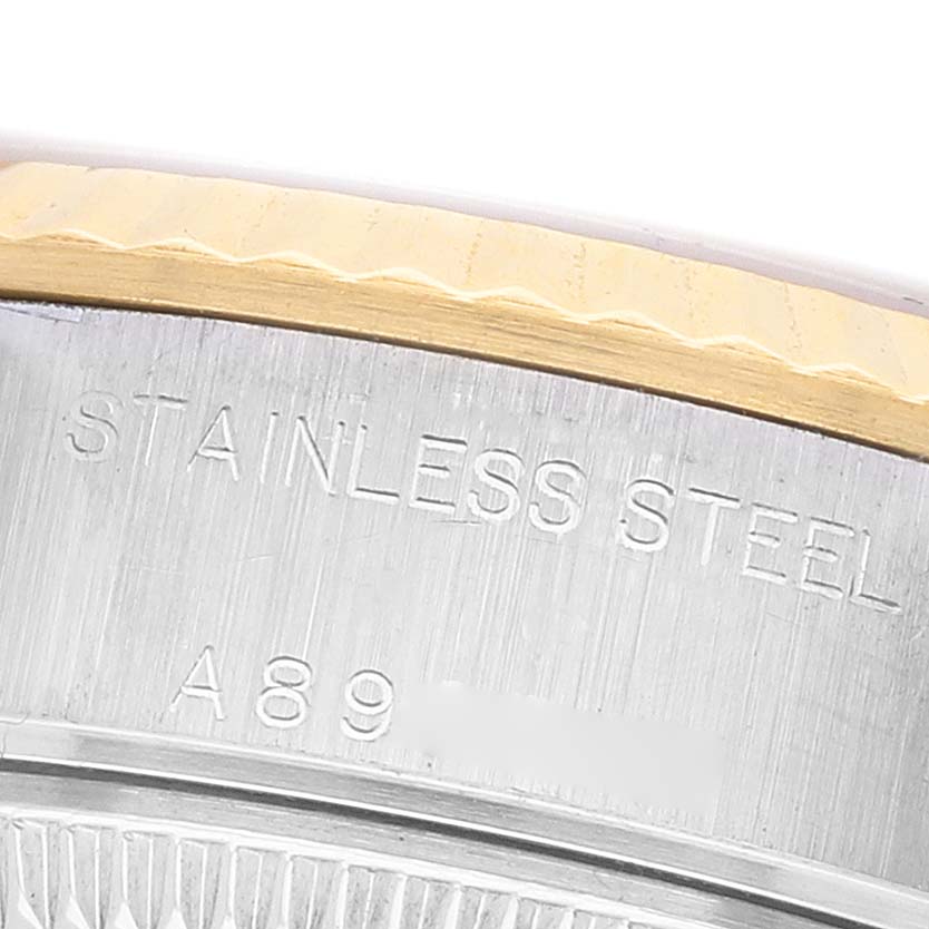 The image shows a close-up of the side of a Rolex Datejust 79173 Women's Stainless Steel Silver Dial, highlighting the stainless steel case with visible engravings.
