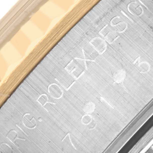 The image shows a close-up of the side of a Rolex Datejust 79173 Women's Steel and Gold (two tone) Grey Dial 79173 Women's Steel and Gold (two tone) Grey Dial watch, focusing on the engraved model details.