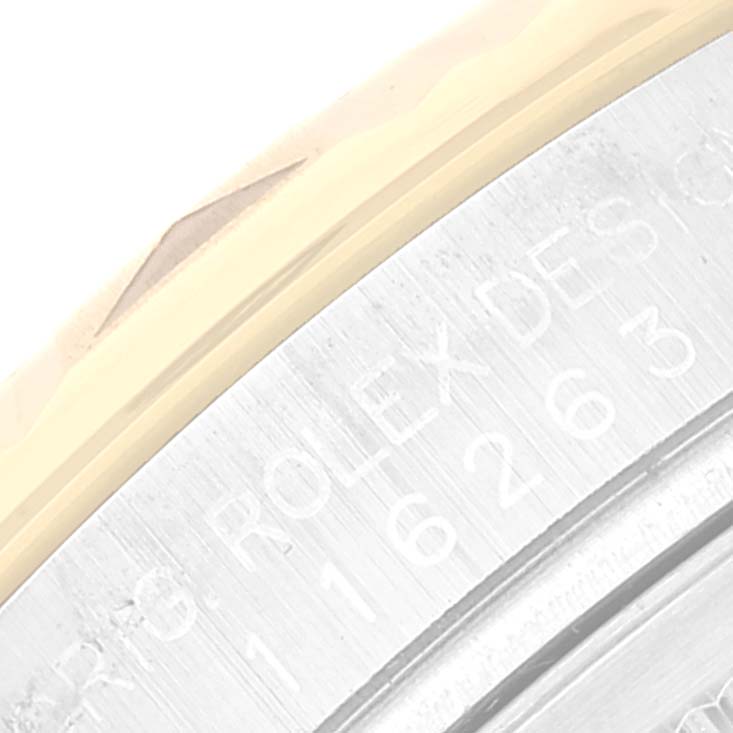 This close-up image shows part of the bezel and case back of the Rolex Turn-o-Graph 116263 Men's Steel and Gold (two tone) Champagne Dial 116263 Men's Steel and Gold (two tone) Champagne Dial watch.