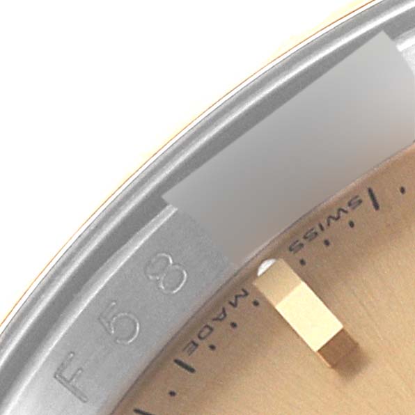 This image shows a close-up of the dial and bezel of a Rolex Turn-o-Graph 116263 Men's Steel and Gold (two tone) Champagne Dial 116263 Men's Steel and Gold (two tone) Champagne Dial watch, including part of the minute markers and case.