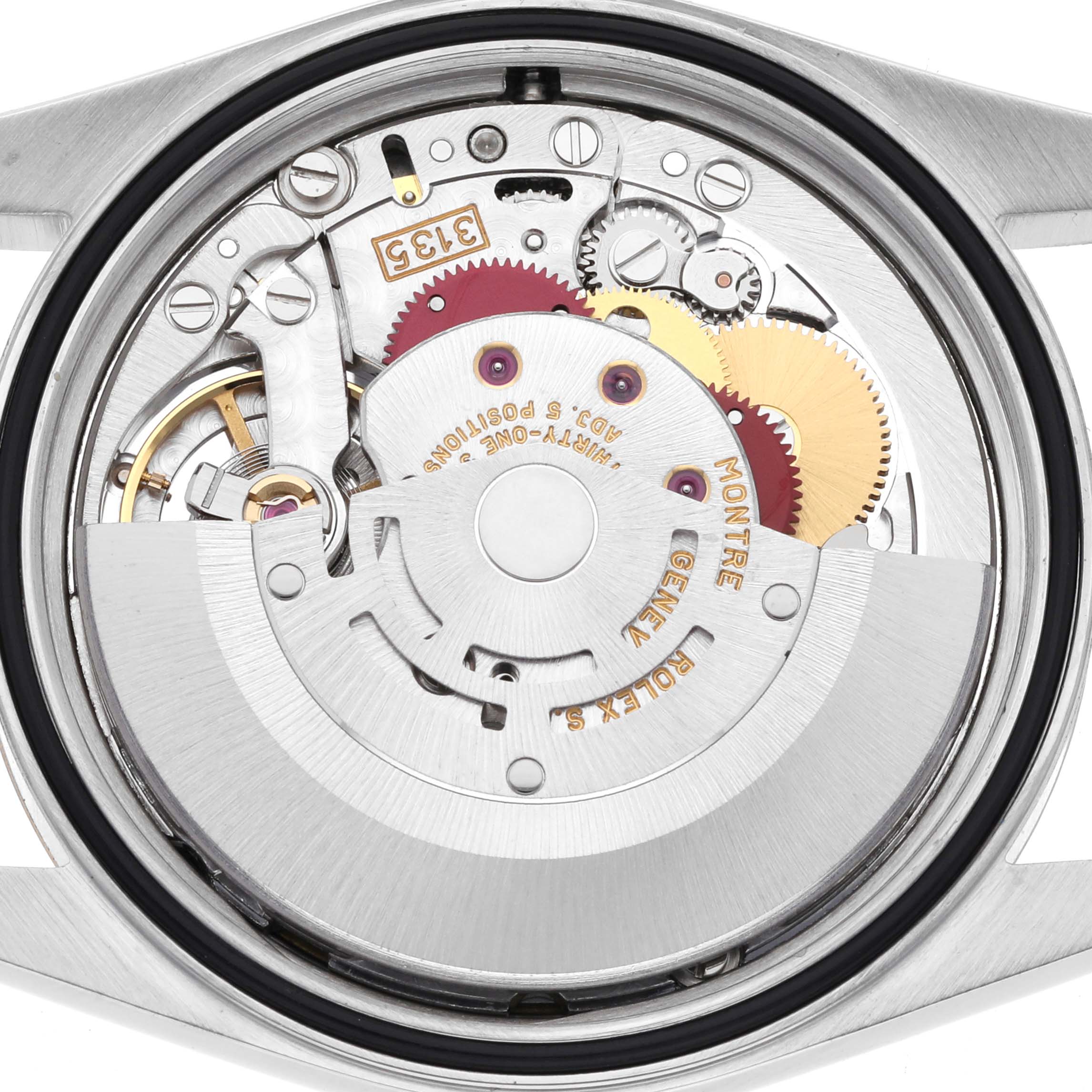 The image shows the movement of a Rolex Datejust 16233 Men's Steel and Gold (two tone) Blue Dial 16233 Men's Steel and Gold (two tone) Blue Dial watch from the back, highlighting gears and mechanical components.