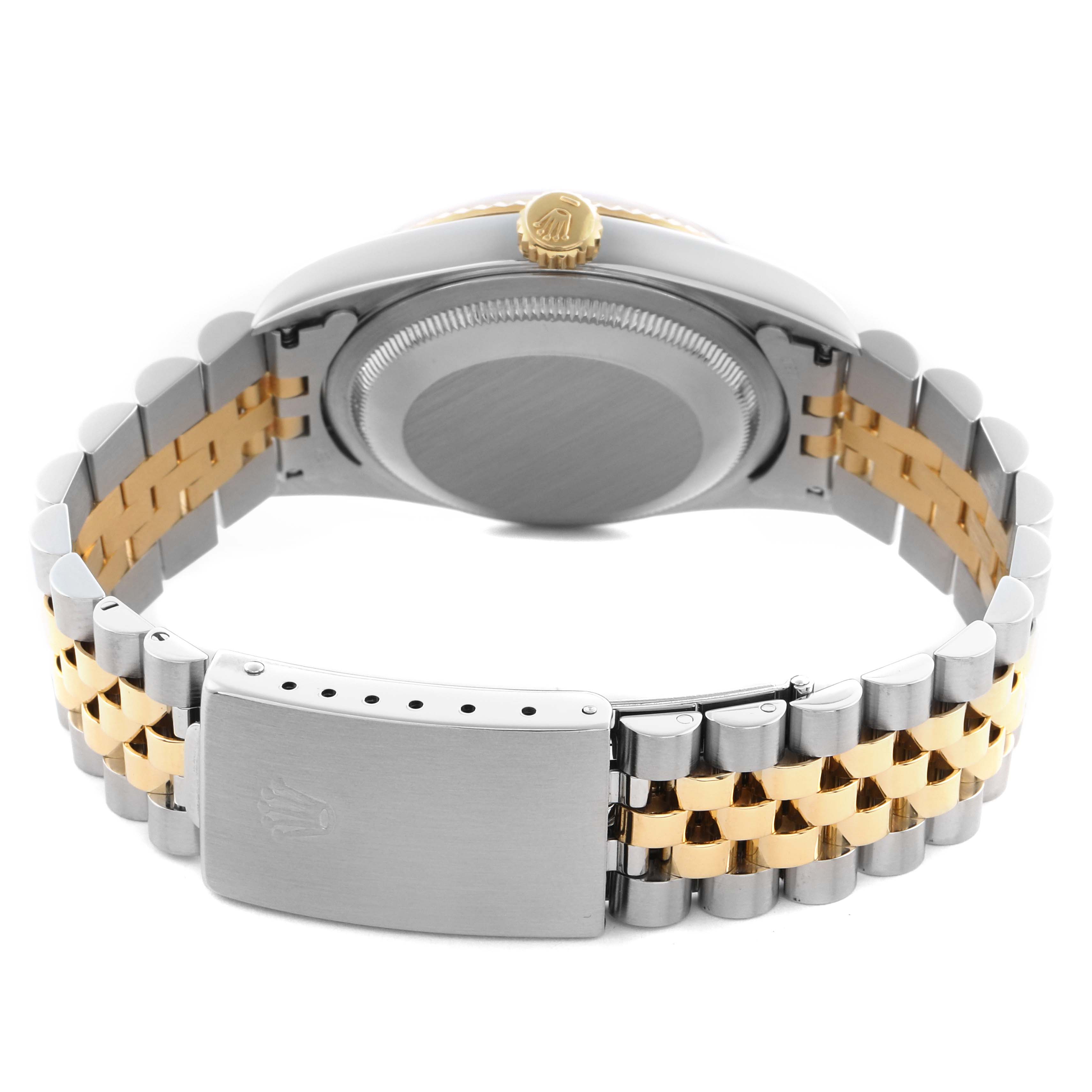 The image shows the back view of a Rolex Datejust 16233 Men's Steel and Gold (two tone) Blue Dial 16233 Men's Steel and Gold (two tone) Blue Dial watch showcasing the case back, crown, and two-tone bracelet with clasp.