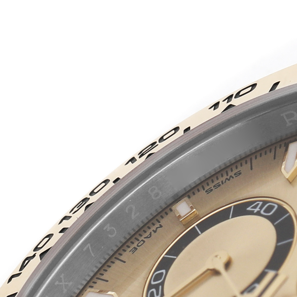 The image shows a close-up of the Rolex Daytona 126503 Men's Steel and Gold (two tone) Champagne Dial's bezel and part of the dial from an angled top view.