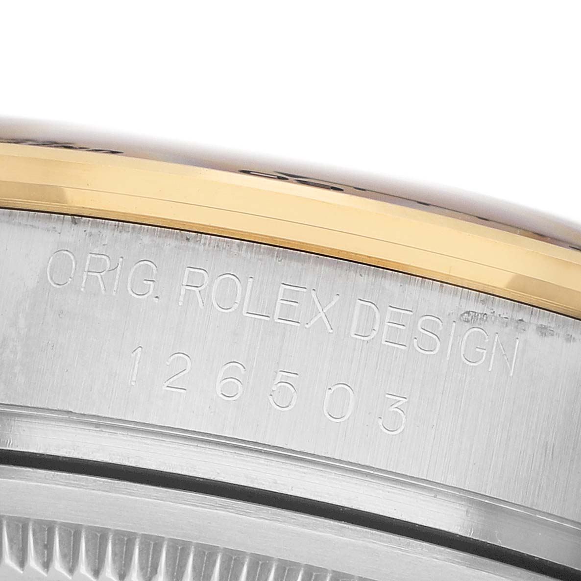 The image shows a close-up angle of the Rolex Daytona 126503 Men's Steel and Gold (two tone) Champagne Dial’s case side, highlighting the engraved design and model number.