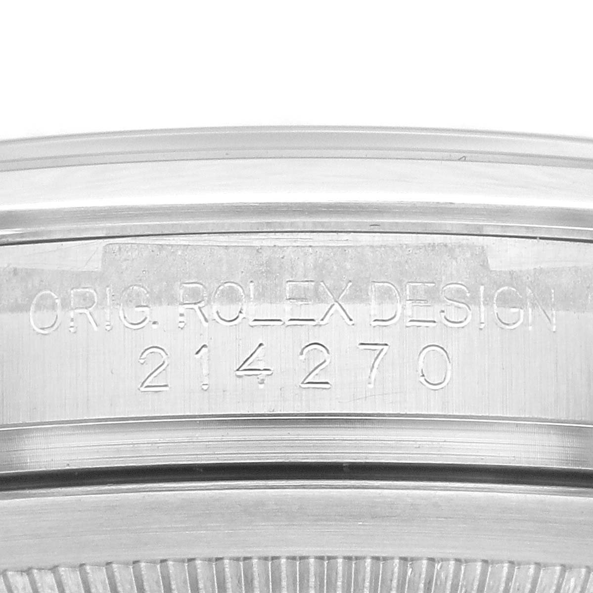 This image shows the engraved serial number and "Rolex Design" on the case of a Rolex Explorer 214270 Men
s Stainless Steel Black Dial 214270 Men
s Stainless Steel Black Dial watch.