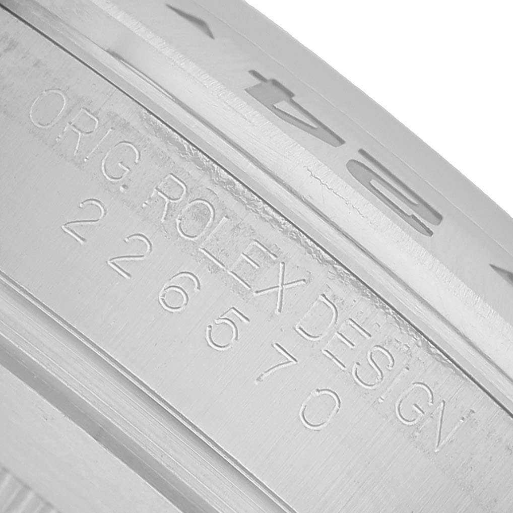 The image shows a close-up of the case back or inner bezel of a Rolex Explorer 226570 Men's Stainless Steel White Dial, highlighting engraved details.