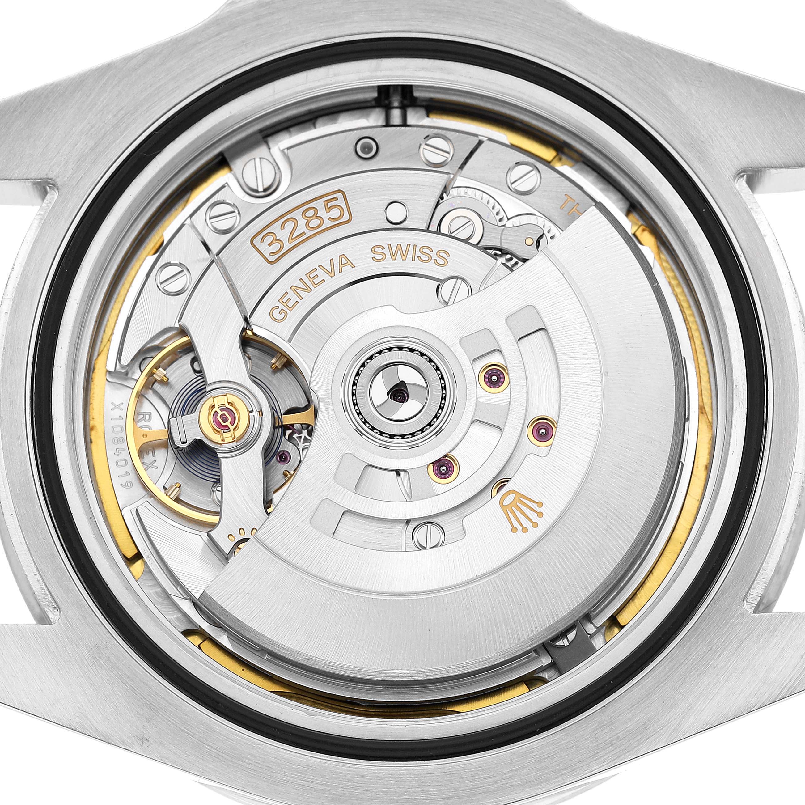 The image shows the movement of a Rolex Explorer 226570 Men's Stainless Steel White Dial watch from the back, highlighting its intricate mechanical parts.