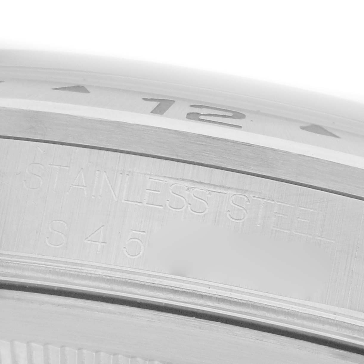 The image shows a close-up of the bezel and case edge of a Rolex Explorer 16570 Men's Stainless Steel White Dial 16570 Men's Stainless Steel White Dial, highlighting the stainless steel material.
