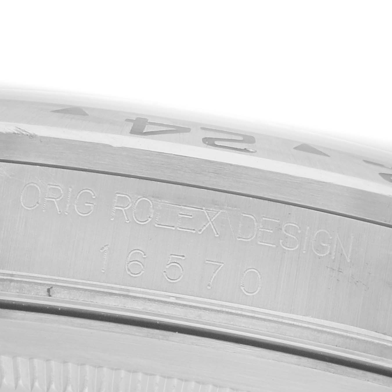 The image shows a close-up angle of the side of a Rolex Explorer 16570 Men's Stainless Steel White Dial 16570 Men's Stainless Steel White Dial, focusing on the model engraving.
