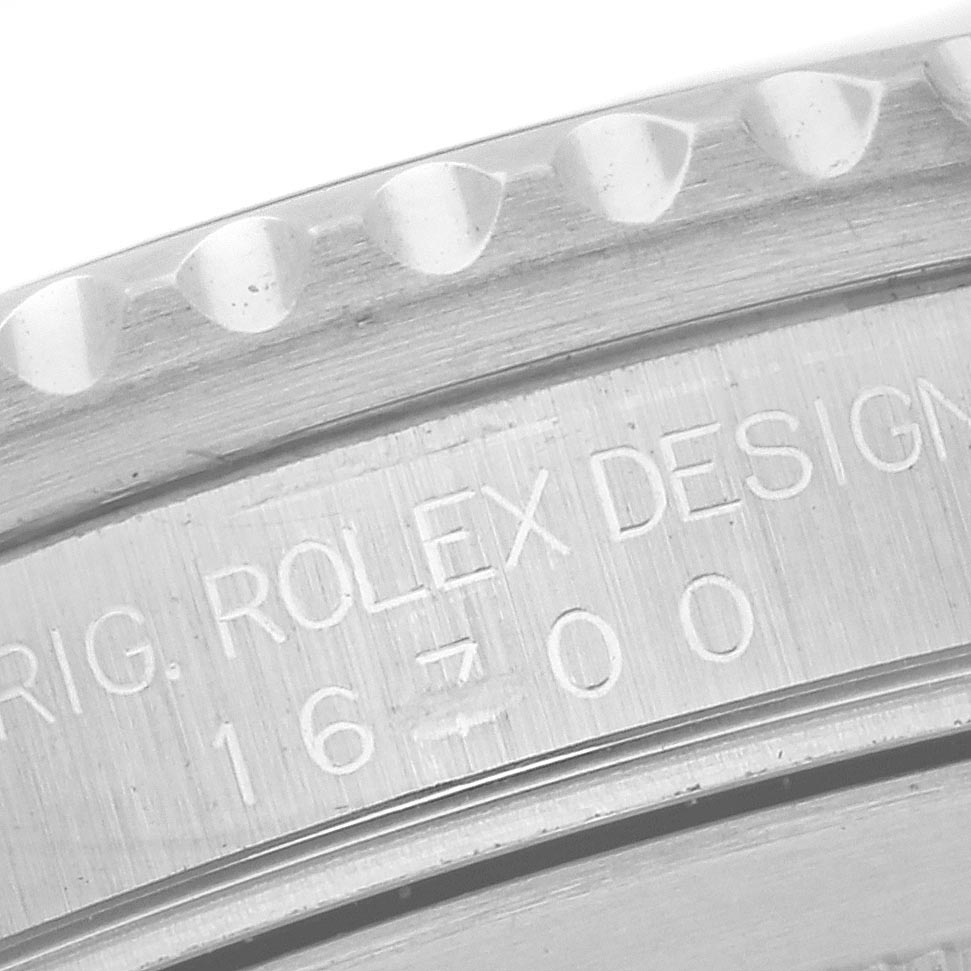 The image shows a close-up of the case back engraving on a Rolex GMT-Master 16700 Men's Stainless Steel Black Dial 16700 Men's Stainless Steel Black Dial, displaying its model number.