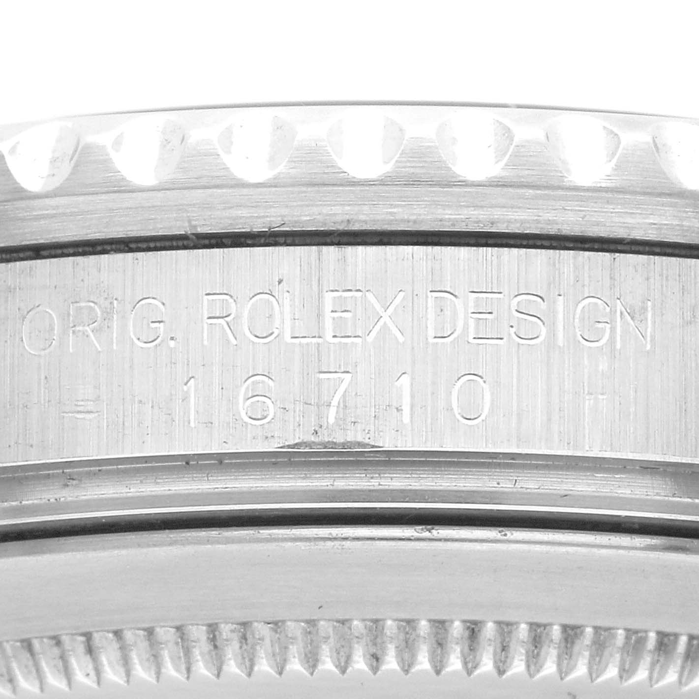 The image shows a close-up of the case side of a Rolex GMT-Master 16710 Men's Stainless Steel Black Dial 16710 Men's Stainless Steel Black Dial watch, highlighting the model and serial number engraving.
