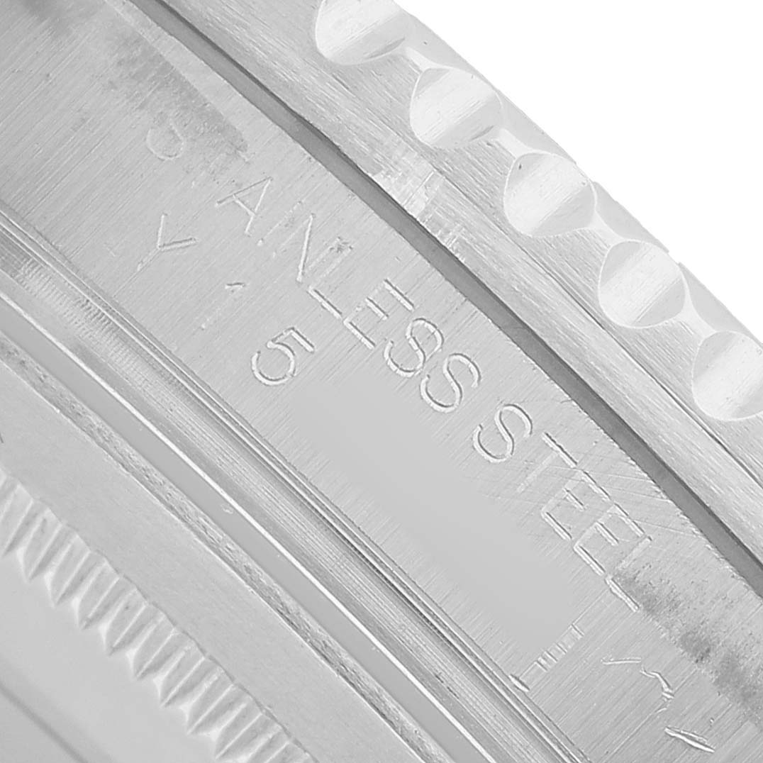 The image shows a close-up of the case side of a Rolex GMT-Master 16710 Men's Stainless Steel Black Dial, highlighting its stainless steel engraving.