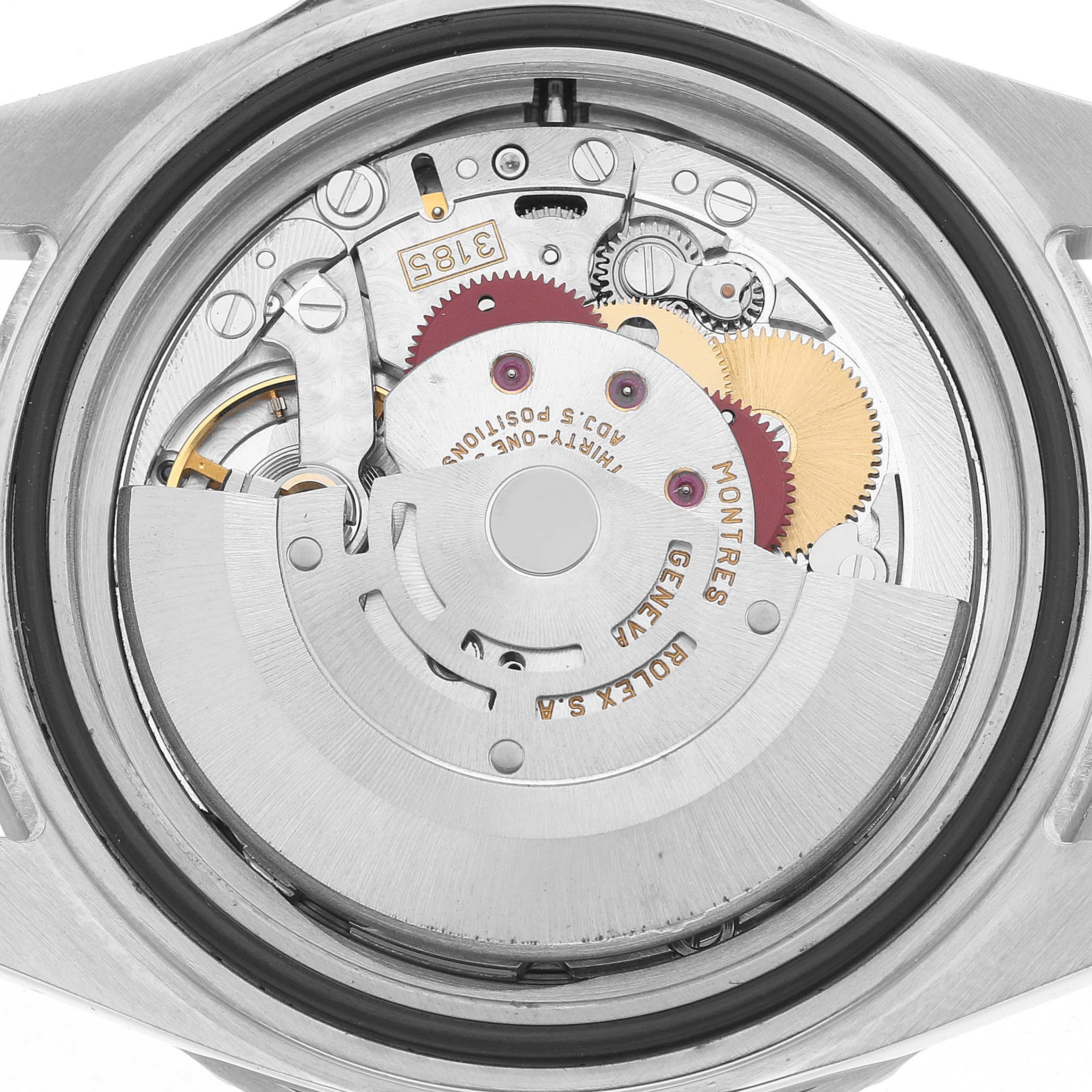 The image shows the back view of a Rolex GMT-Master 16710 Men's Stainless Steel Black Dial, focusing on its movement and intricate gears.