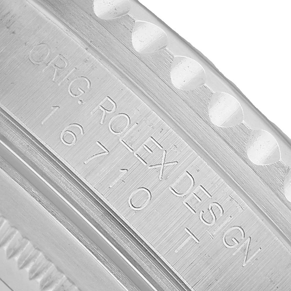 The image shows a close-up of the case side, focusing on the engraved watch model "16710" of the Rolex GMT-Master 16710 Men's Stainless Steel Black Dial.