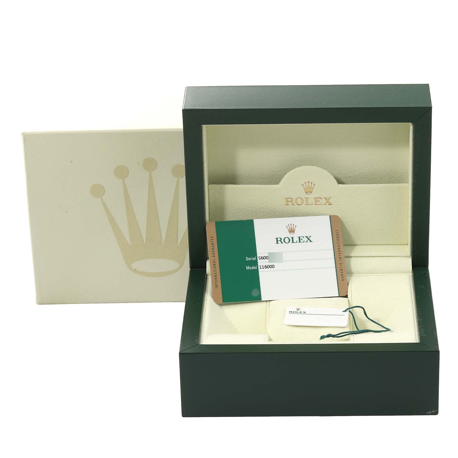 This image shows an open green Rolex box with a card displaying the Oyster Perpetual model, serial number, and model number.